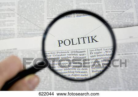 Reading the newspaper with a magnifying glass View Large Photo Image Picture - Reading the newspaper with a magnifying glass. Fotosearch