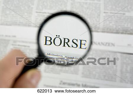 Reading the newspaper with a magnifying glass View Large Photo Image Stock Image - Reading the newspaper with a magnifying glass. Fotosearch