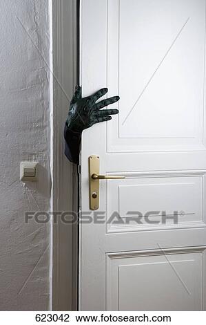 A monster's hand reaching from a behind a door View Large Photo Image Stock Image - A monster's hand reaching from a behind a door. Fotosearch