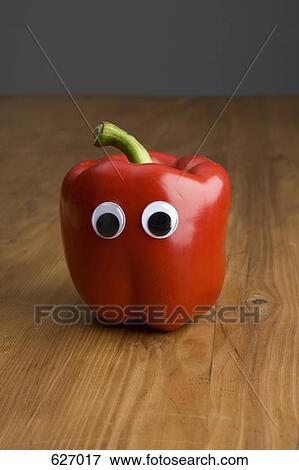 A red bell pepper with plastic eyeballs View Large Photo Image Stock Photo - A red bell pepper with plastic eyeballs. Fotosearch