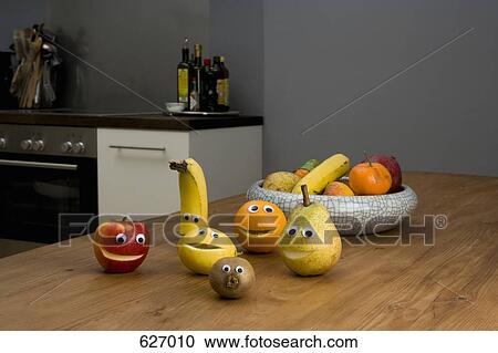 Fruit with smiley faces on a kitchen table View Large Photo Image Stock Image - Fruit with smiley faces on a kitchen table. Fotosearch