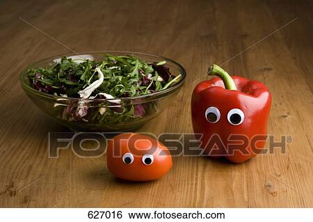 Stock Photograph - Vegetables with eyeballs and a salad bowl. Fotosearch