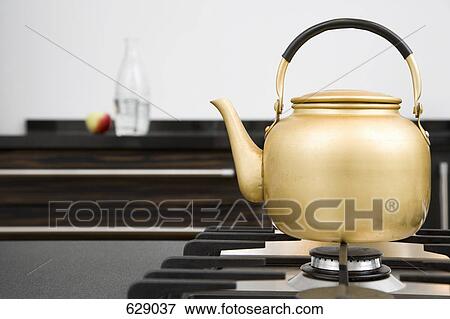 A kettle on a hob View Large Photo Image Stock Photo - A kettle on a hob. Fotosearch