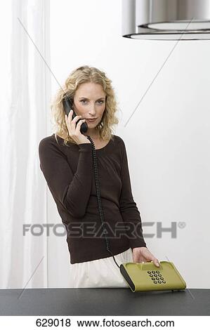 A woman on the phone View Large Photo Image Stock Photo - A woman on the phone. Fotosearch