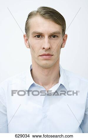Portrait of a man in a blue shirt View Large Photo Image Picture - Portrait of a man in a blue shirt. Fotosearch