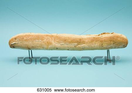 A baguette resting on four nails View Large Photo Image Stock Photography - A baguette resting on four nails. Fotosearch