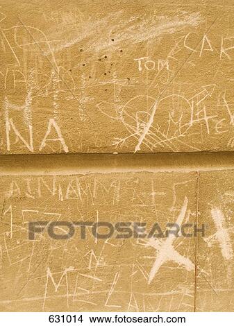 Close Up of cement blocks with graffiti carved in them View Large Photo Image Picture - Close Up of cement blocks with graffiti carved in them. Fotosearch