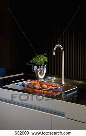 A colander of Tomatoes in a kitchen sink View Large Photo Image Stock Photo - A colander of Tomatoes in a kitchen sink. Fotosearch