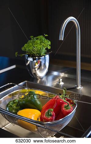 A colander of vegetables in a kitchen sink View Large Photo Image Stock Image - A colander of vegetables in a kitchen sink. Fotosearch