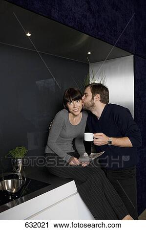 A mature man kissing the cheek of a mid adult woman, smiling View Large Photo Image Stock Image - A mature man kissing the cheek of a mid adult woman, smiling. Fotosearch