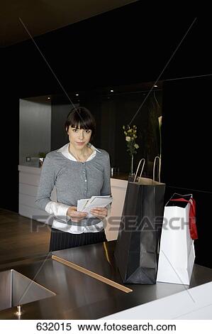 A woman holding mail View Large Photo Image Stock Photography - A woman holding mail. Fotosearch