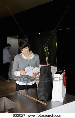 A woman reading the mail View Large Photo Image Stock Photo - A woman reading the mail. Fotosearch