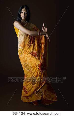Picture - A woman dressed in traditional Indian clothing. Fotosearch