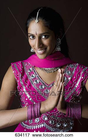 A woman dressed in traditional Indian clothing View Large Photo Image Stock Photo - A woman dressed in traditional Indian clothing. Fotosearch