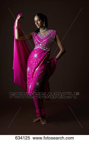 A woman dressed in traditional Indian clothing View Large Photo Image Stock Photography - A woman dressed in traditional Indian clothing. Fotosearch