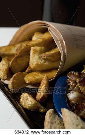 Close-Up of a serving of fish and chips View Large Photo Image Stock Image - Close-Up of a serving of fish and chips. Fotosearch