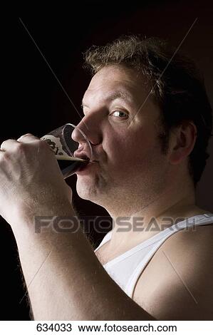 Profile portrait of a stereotypical Englishman drinking a pint View Large Photo Image Stock Image - Profile portrait of a stereotypical Englishman drinking a pint. Fotosearch