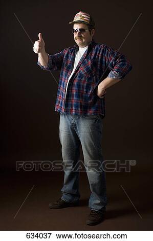 Stereotypical American man giving the ‘thumbs up’ sign View Large Photo Image Stock Photo - Stereotypical American man giving the ‘thumbs up’ sign. Fotosearch