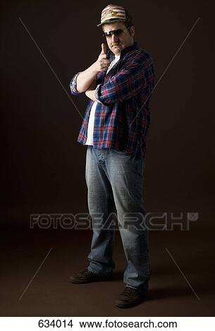 Stereotypical American Man posing and making the ‘bang bang’ hand greeting View Large Photo Image Picture - Stereotypical American Man posing and making the ‘bang bang’ hand greeting. Fotosearch