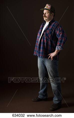Stereotypical American man standing and staring at something off camera View Large Photo Image Stock Image - Stereotypical American man standing and staring at something off camera. Fotosearch