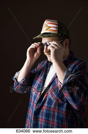 Stereotypical American Man taking off sunglasses View Large Photo Image Stock Photograph - Stereotypical American Man taking off sunglasses. Fotosearch