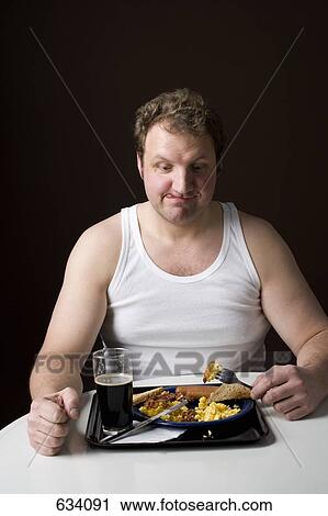 Stereotypical Englishman eating an English breakfast View Large Photo Image Stock Image - Stereotypical Englishman eating an English breakfast. Fotosearch