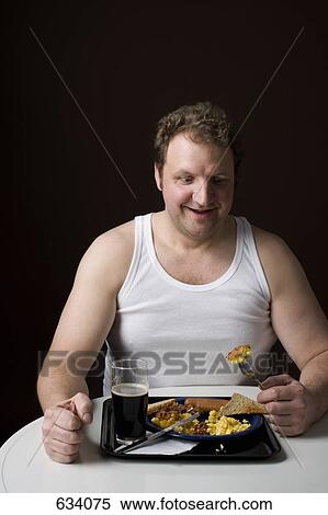 Stereotypical Englishman eating an English breakfast View Large Photo Image Stock Photography - Stereotypical Englishman eating an English breakfast. Fotosearch