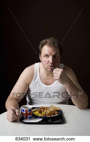Stereotypical Englishman eating English breakfast View Large Photo Image Stock Image - Stereotypical Englishman eating English breakfast. Fotosearch