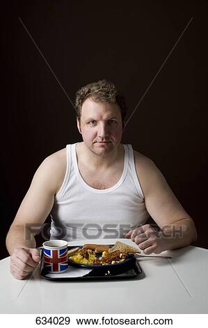 Stereotypical Englishman with an English breakfast View Large Photo Image Stock Photo - Stereotypical Englishman with an English breakfast. Fotosearch
