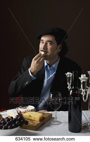 Stereotypical French man tasting French cheese View Large Photo Image Stock Photography - Stereotypical French man tasting French cheese. Fotosearch