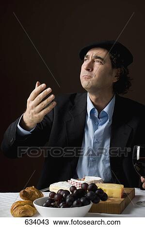 Stereotypical French man with stereotypical French food View Large Photo Image Stock Image - Stereotypical French man with stereotypical French food. Fotosearch