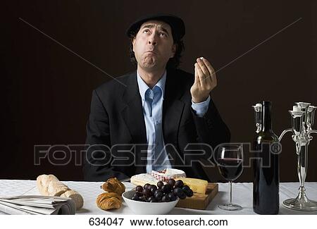 Stock Photo - Stereotypical French man with stereotypical French food. Fotosearch