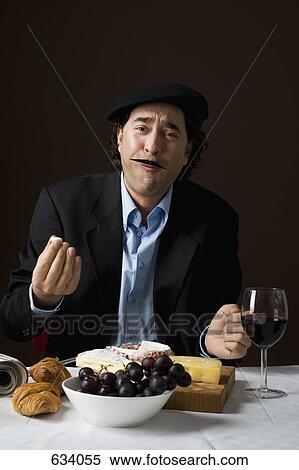 Stereotypical French man with stereotypical French food View Large Photo Image Stock Photography - Stereotypical French man with stereotypical French food. Fotosearch