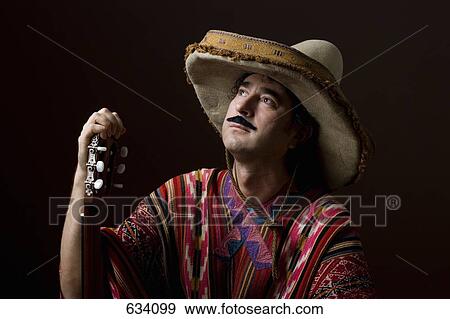 Stereotypical Mexican man staring off into space with a dreamy expression View Large Photo Image Stock Photo - Stereotypical Mexican man staring off into space with a dreamy expression. Fotosearch