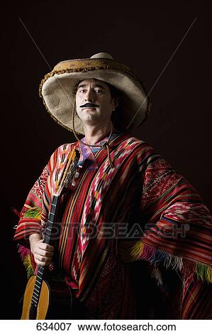 Stereotypical Mexican man with a guitar View Large Photo Image Stock Photo - Stereotypical Mexican man with a guitar. Fotosearch