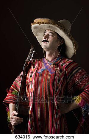 Stereotypical Mexican man with a guitar View Large Photo Image Stock Photograph - Stereotypical Mexican man with a guitar. Fotosearch