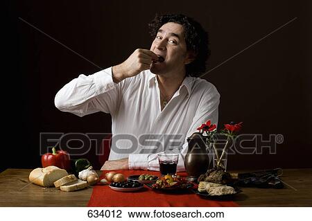 Stereotypical Spanish man eating tapas View Large Photo Image Stock Image - Stereotypical Spanish man eating tapas. Fotosearch