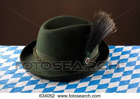 Stock Image - Still life of a stereotypical German hat, alpine hat. Fotosearch