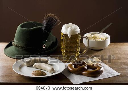 Still life of stereotypical German food, beer and hat View Large Photo Image Stock Image - Still life of stereotypical German food, beer and hat. Fotosearch