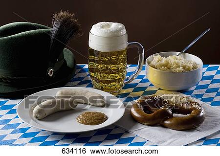 Still life of stereotypical German food, beer and hat View Large Photo Image Stock Photograph - Still life of stereotypical German food, beer and hat. Fotosearch
