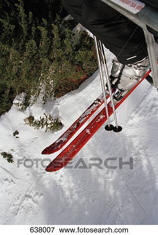 A skier sitting on ski lift View Large Photo Image Stock Photo - A skier sitting on ski lift. Fotosearch