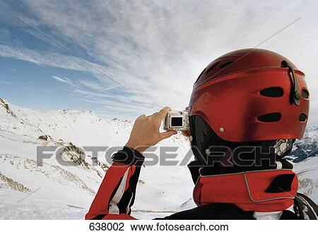 A skier taking a photograph of the Austrian Alps View Large Photo Image Stock Image - A skier taking a photograph of the Austrian Alps. Fotosearch