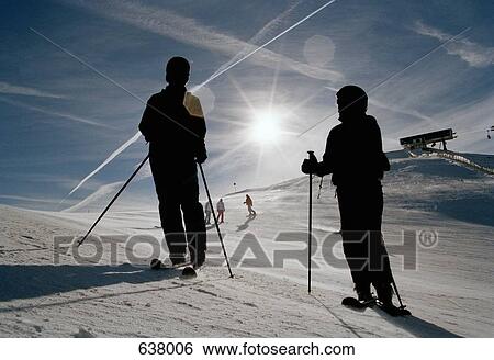 Skiers on a ski slope View Large Photo Image Stock Photograph - Skiers on a ski slope. Fotosearch