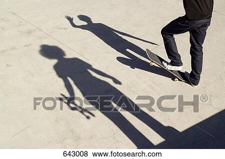 Shadows on two skateboarders on concrete View Large Photo Image Stock Photo - Shadows on two skateboarders on concrete. Fotosearch
