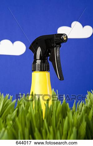A spray bottle in grass View Large Photo Image Stock Photo - A spray bottle in grass. Fotosearch