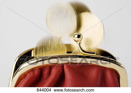 Coins falling into a purse View Large Photo Image Picture - Coins falling into a purse. Fotosearch
