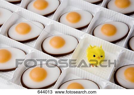 Sweet eggs and chick in a tray View Large Photo Image Stock Image - Sweet eggs and chick in a tray. Fotosearch