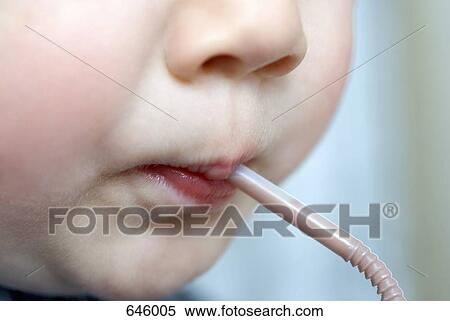 A preschool boy drinking from a straw View Large Photo Image Stock Photography - A preschool boy drinking from a straw. Fotosearch