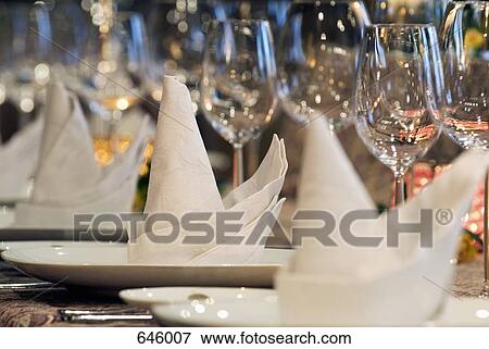 An elegantly set dining table, close up View Large Photo Image Stock Photo - An elegantly set dining table, close up. Fotosearch