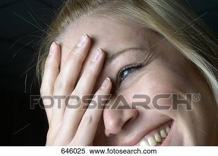 Portrait of a woman laughing, close up View Large Photo Image Stock Photography - Portrait of a woman laughing, close up. Fotosearch
